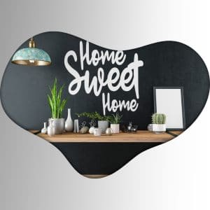 Green cooking pot with wooden handles and white lid on kitchen counter with fresh vegetables, bowls, and spice jars