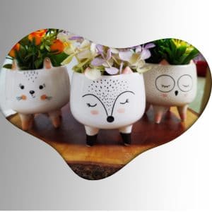 Modern two-story house exterior with large windows, warm interior lighting, and wooden garage door