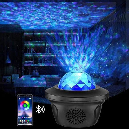 Bluetooth speaker with LED star projector displaying blue galaxy lights in a dark room with smartphone control