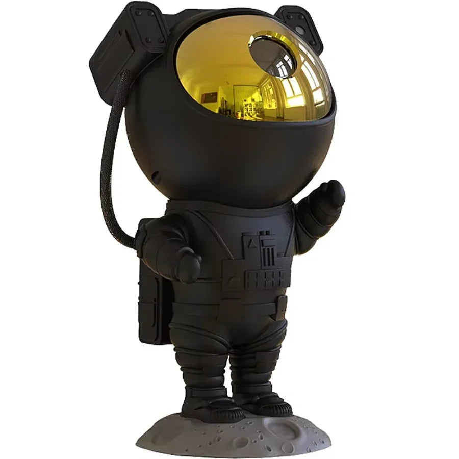 Bluetooth speaker with LED star projector displaying blue galaxy lights in a dark room with smartphone control